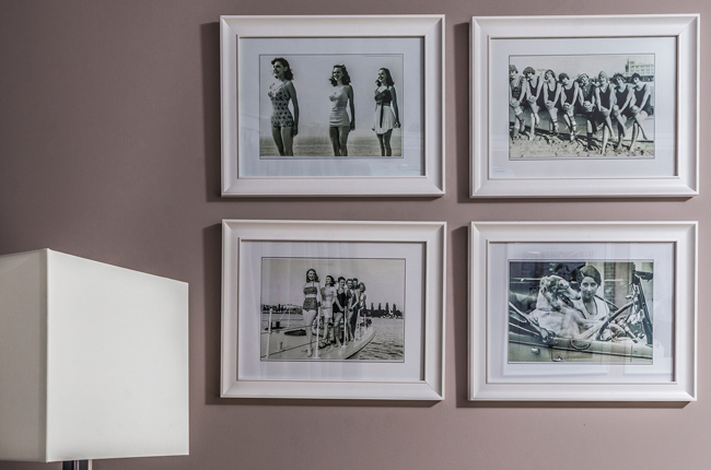 collection of framed photos on wall