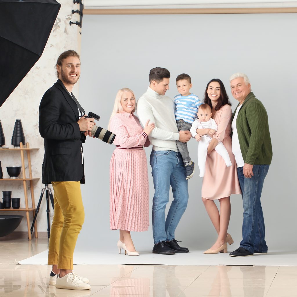 Photographer working with a family in the studio.